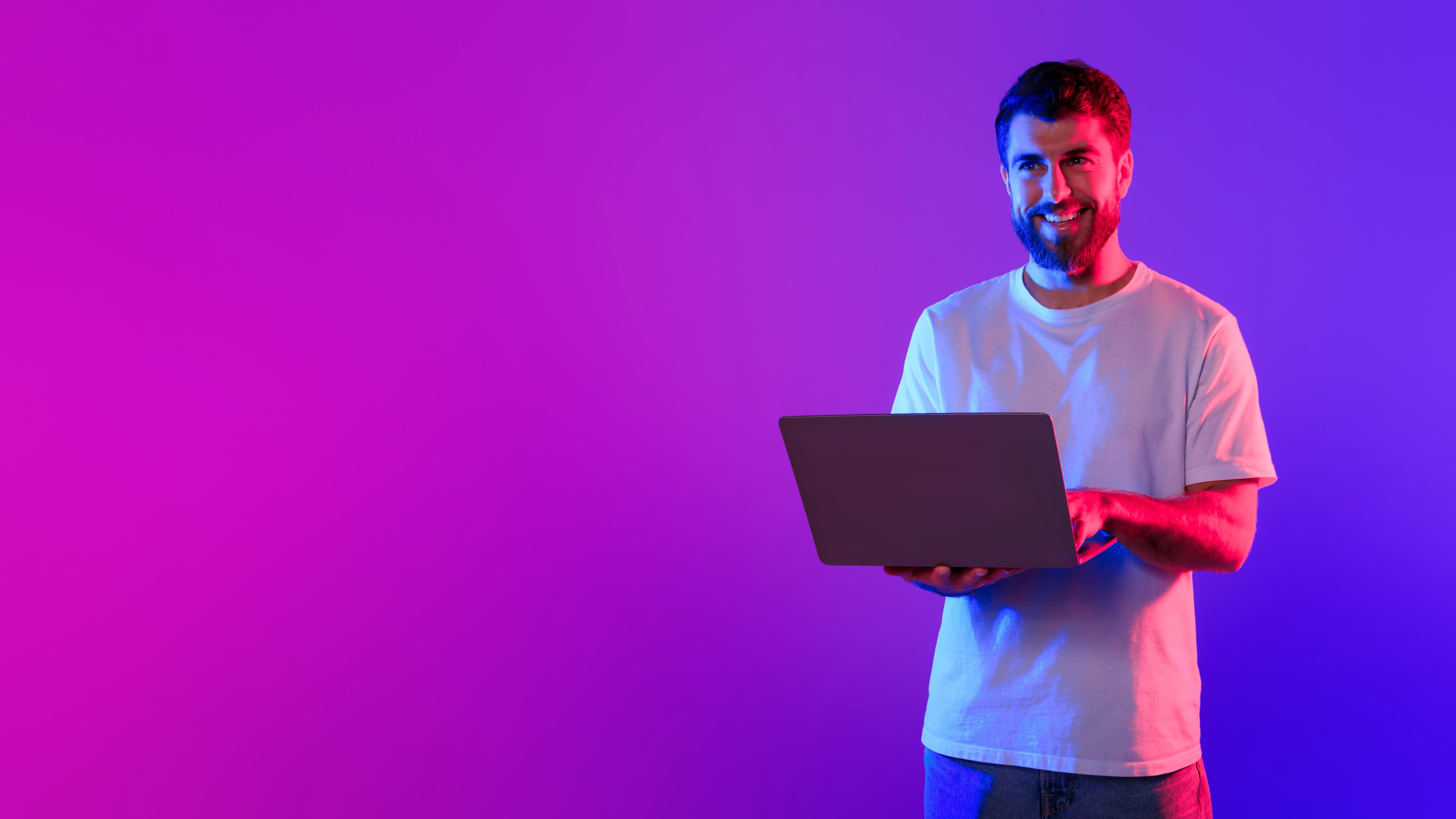 Young man using laptop in studio representing clear messaging and conversion-focused web layout